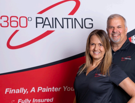 Tom standing in front of 360 Painting logo